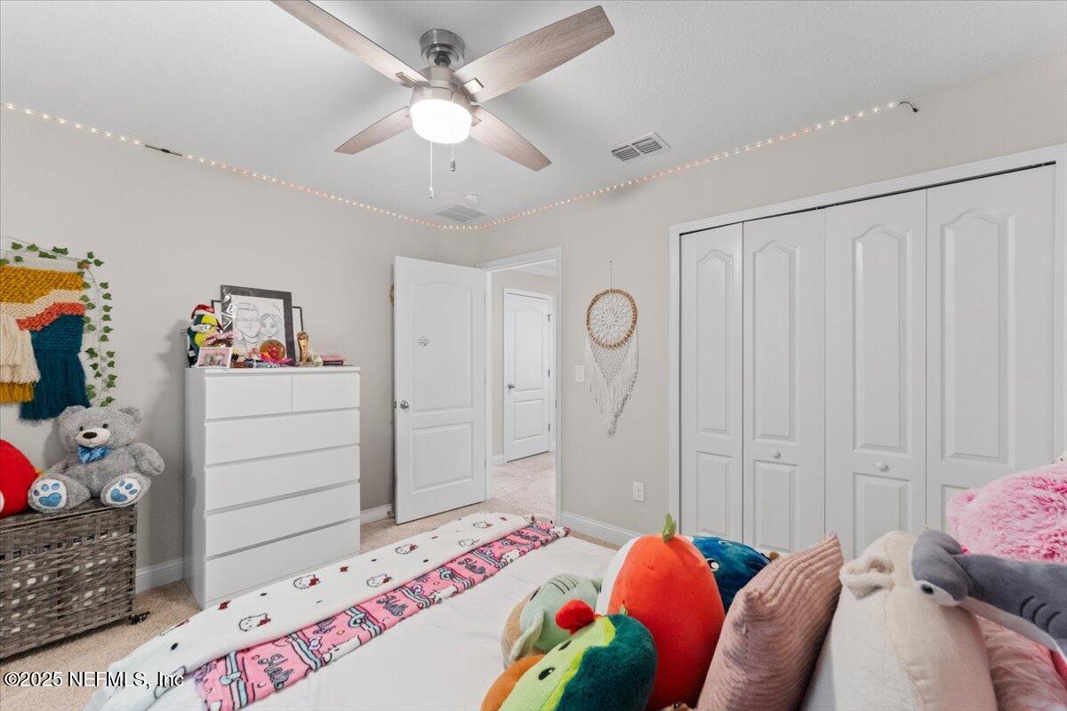 3060 Free Bird Loop Green Cove Springs, FL 32043 - Photo 28 of 94 a bedroom with a bed and a window