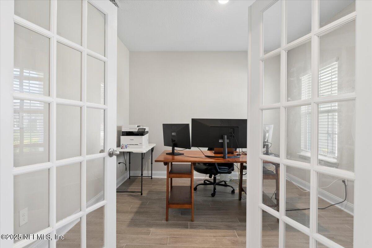 3060 Free Bird Loop Green Cove Springs, FL 32043 - Photo 5 of 94 a workspace with wooden floor and a window