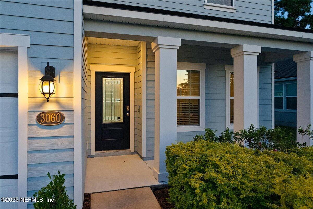 3060 Free Bird Loop Green Cove Springs, FL 32043 - Photo 60 of 94 a front view of a house with a porch