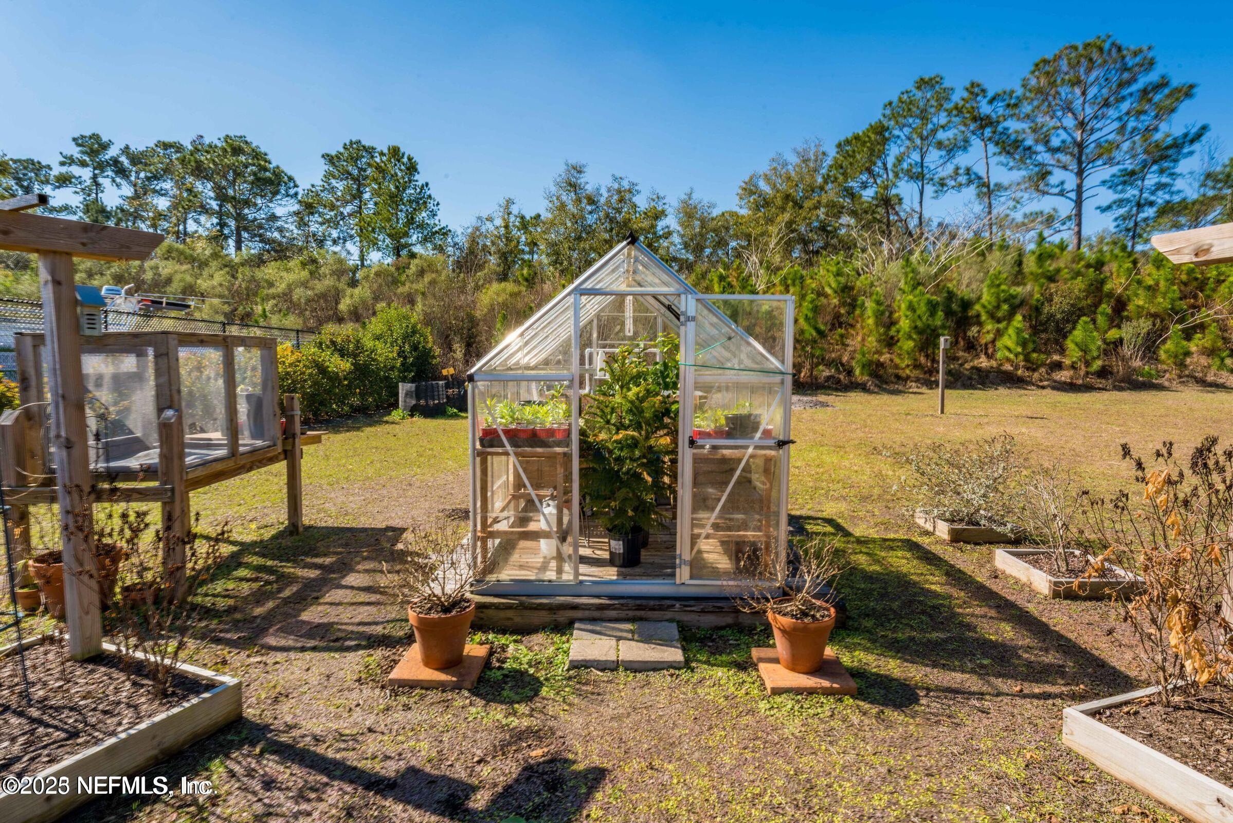 3060 Free Bird Loop Green Cove Springs, FL 32043 - Photo 86 of 94 a front view of a house with a yard