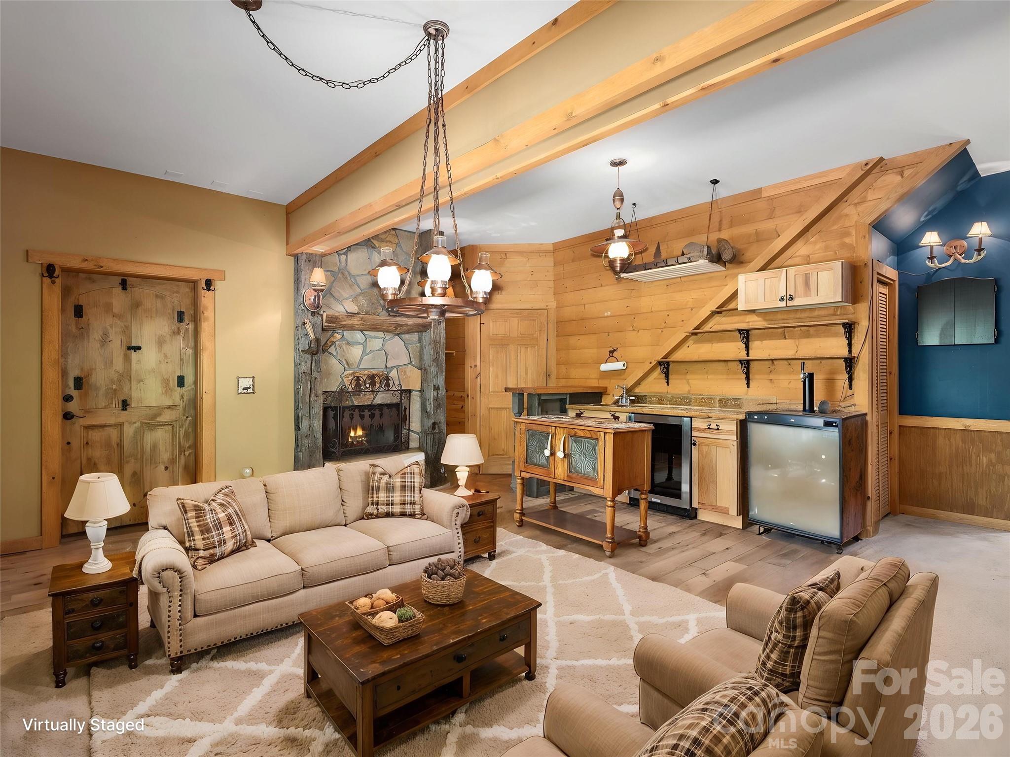 413 Green Hills Road Mill Spring, NC 28756 - Photo 31 of 48 a living room with furniture and a chandelier