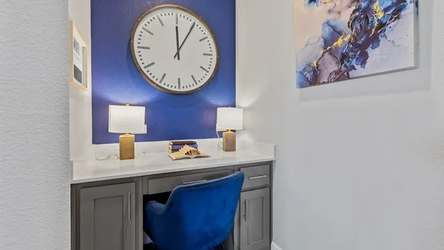 a view of kitchen with cabinets table and chairs