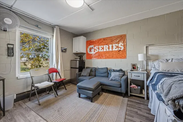 a living room with furniture and a window