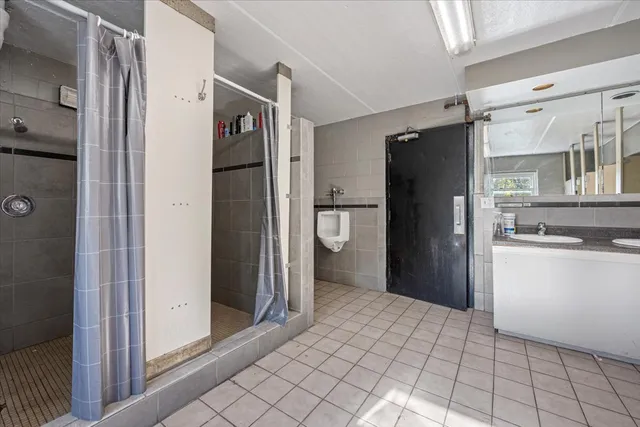 a kitchen with stainless steel appliances granite countertop a refrigerator and a stove