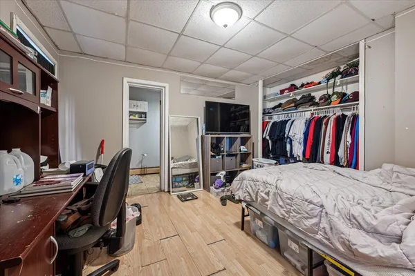 a bedroom with a bed and a bookshelf