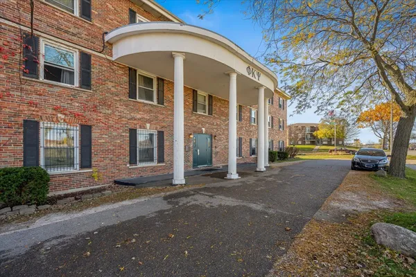 a view of a building with a street
