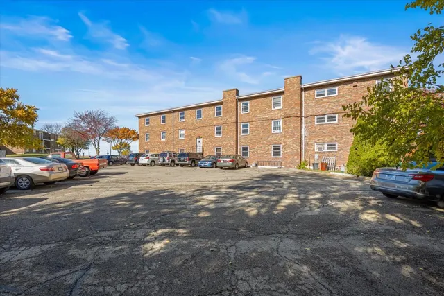 a view of street with parked cars