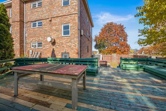 a table and chairs in front of the house