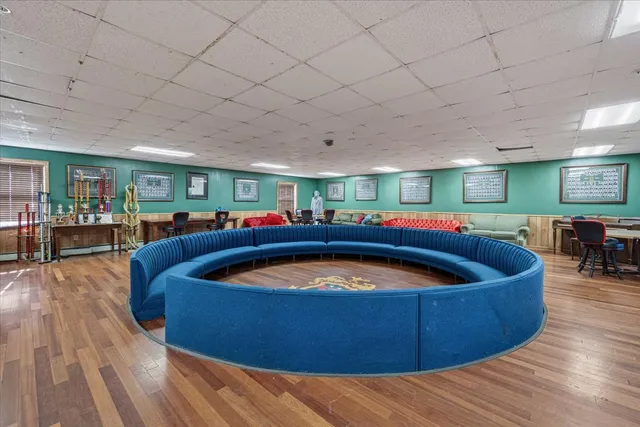 a living room with pool table and furniture