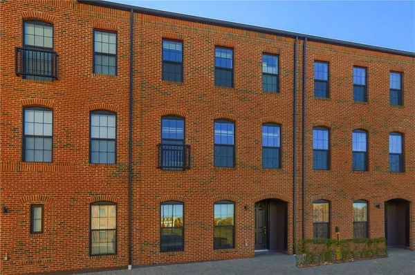 a front view of a building with multiple windows