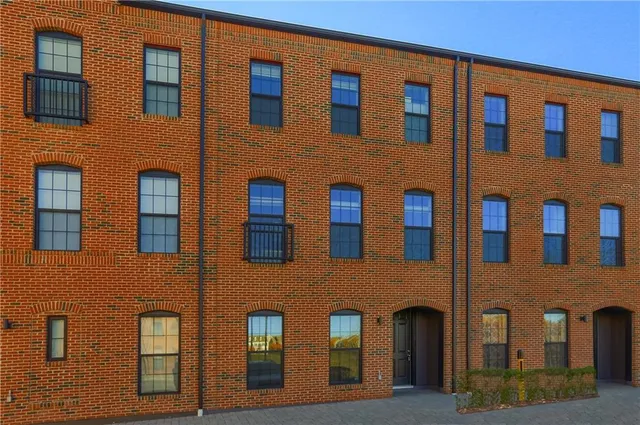 a front view of a building with multiple windows