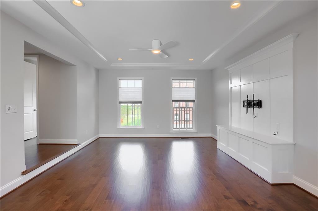 602 Gratitude Road Cranberry Township, PA 16066 - Photo 12 of 29 a view of an empty room with a window and wooden floor