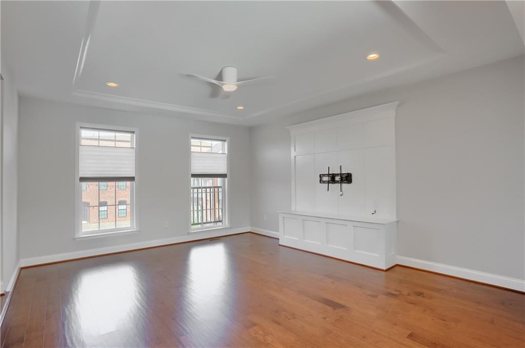 602 Gratitude Road Cranberry Township, PA 16066 - Photo 13 of 29 an empty room with wooden floor and windows