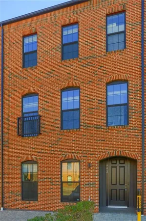 a building with a door and a yard