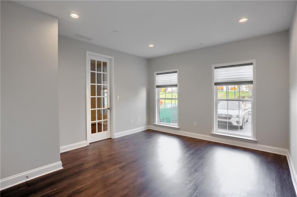 602 Gratitude Road Cranberry Township, PA 16066 - Photo 23 of 29 an empty room with wooden floor and windows