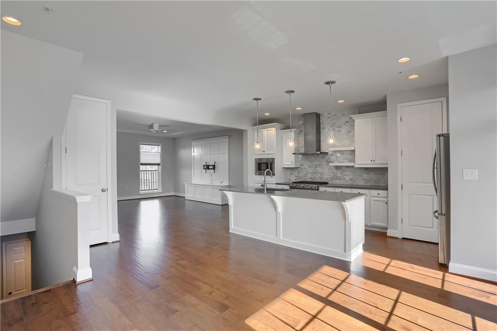 602 Gratitude Road Cranberry Township, PA 16066 - Photo 4 of 29 a large kitchen with granite countertop a large counter top and stainless steel appliances