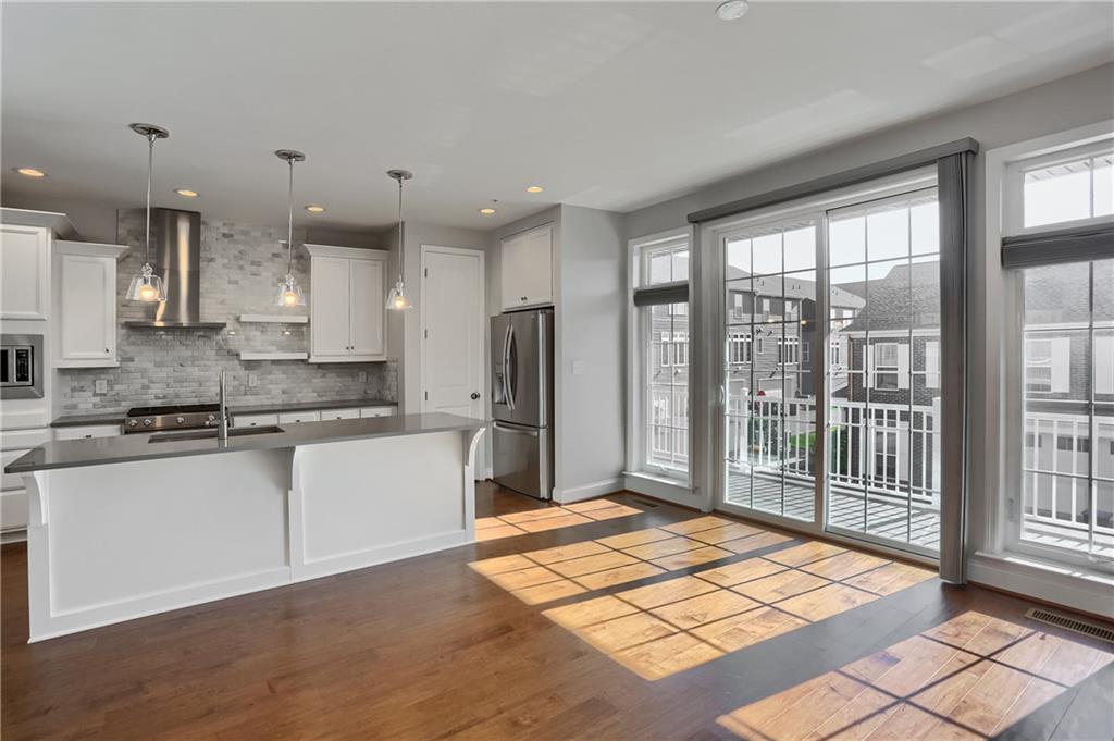 602 Gratitude Road Cranberry Township, PA 16066 - Photo 5 of 29 a kitchen with stainless steel appliances granite countertop a refrigerator and a sink