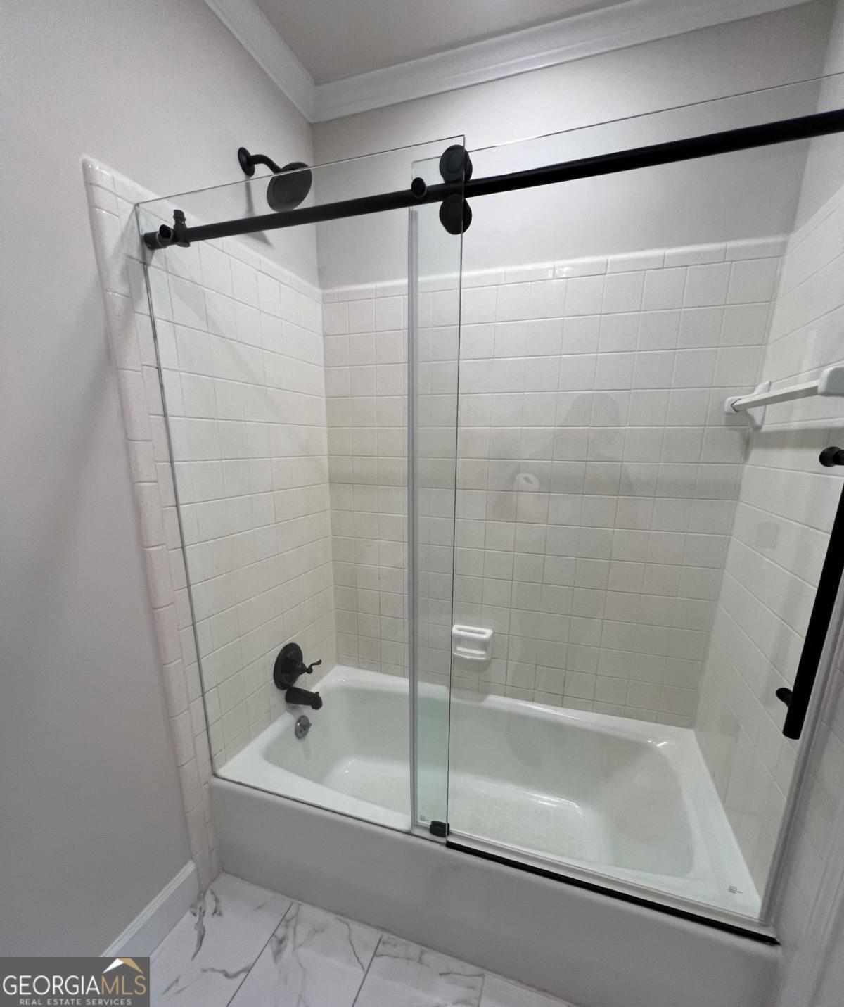 213 Fair Street Baxley, GA 31513 - Photo 21 of 29 a bathroom with a bathtub and a shower