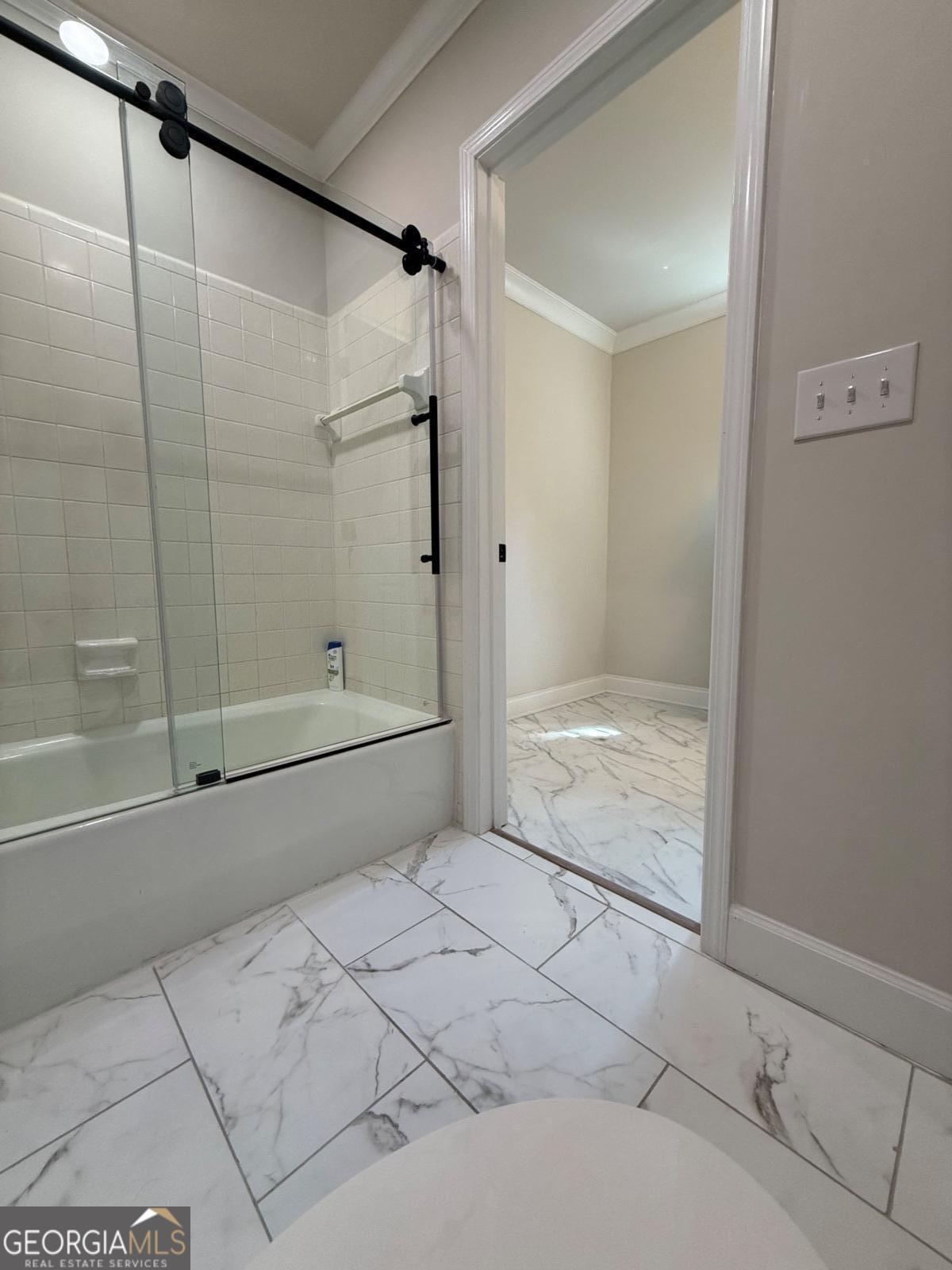 213 Fair Street Baxley, GA 31513 - Photo 22 of 29 a bathroom with a bathtub and a shower