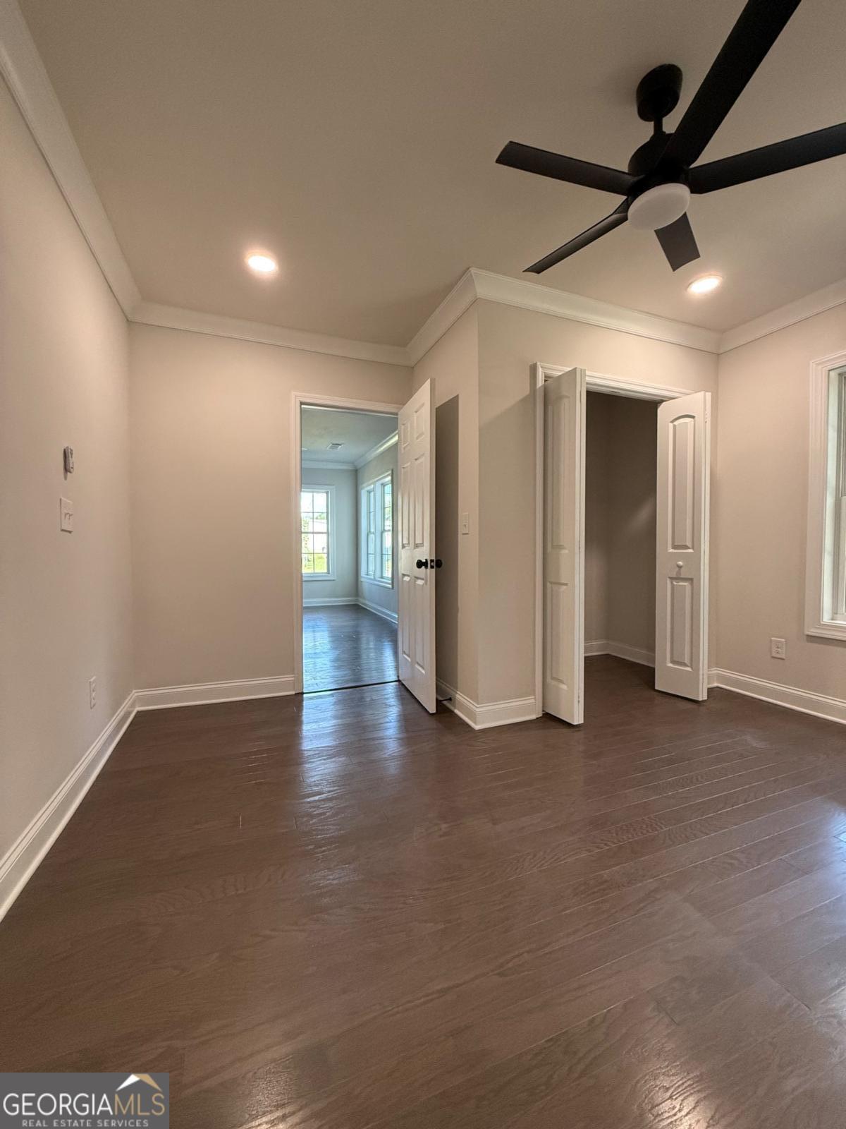 213 Fair Street Baxley, GA 31513 - Photo 26 of 29 a view of empty room with wooden floor