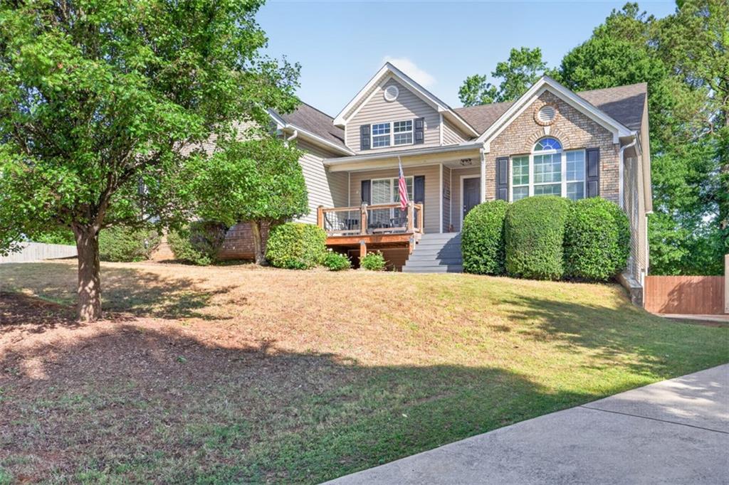 89 Katie Spring Lane Jefferson, GA 30549 - Photo 2 of 63 a front view of a house with a yard