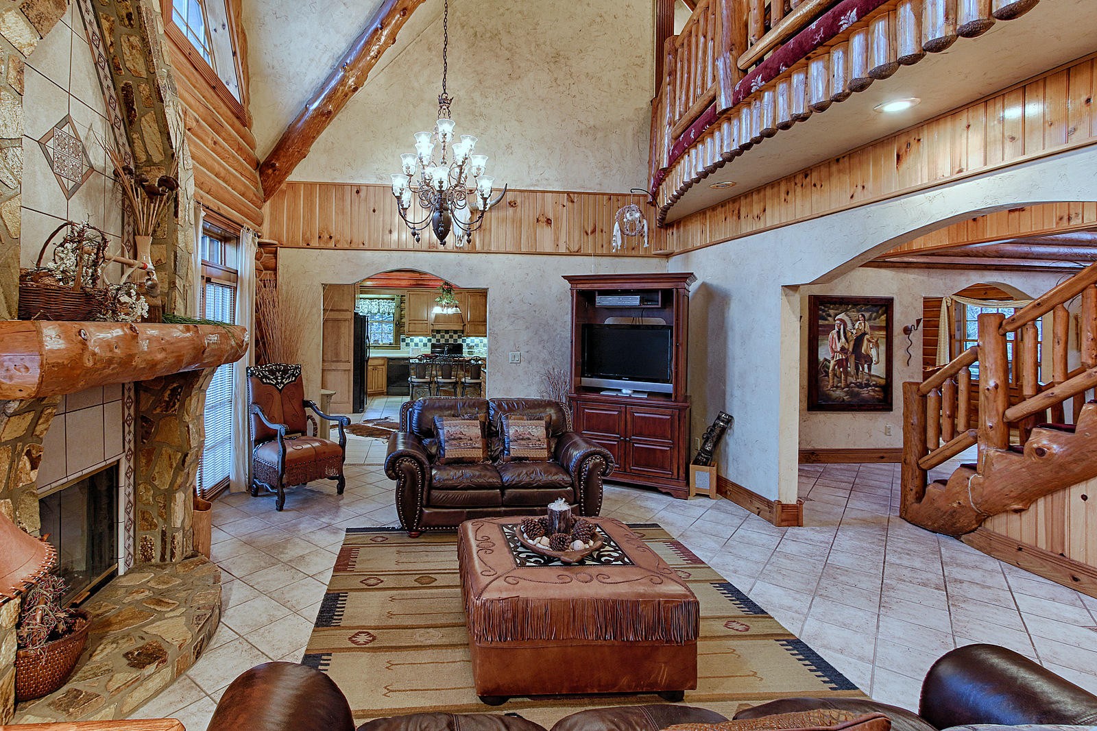1240 Grape Rough Road Oneida, TN 37841 - Photo 22 of 40 a living room with furniture a fireplace and a flat screen tv