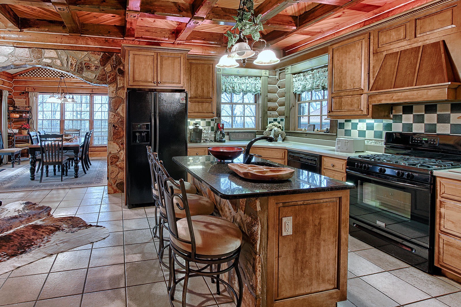 1240 Grape Rough Road Oneida, TN 37841 - Photo 27 of 40 a kitchen with stainless steel appliances granite countertop a sink a stove and a refrigerator