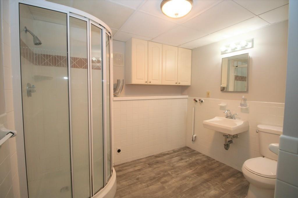 10 Silverbrook Road Topsfield, MA 01983 - Photo 18 of 25 a bathroom with a sink a toilet and shower