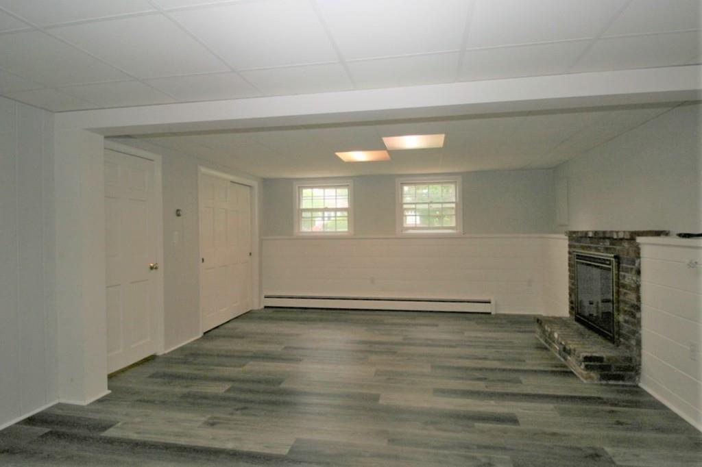 10 Silverbrook Road Topsfield, MA 01983 - Photo 20 of 25 a view of an empty room with wooden floor and a window