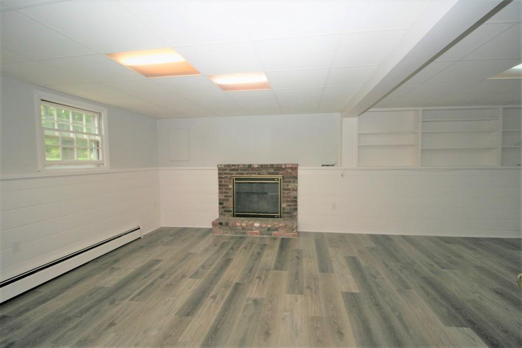 10 Silverbrook Road Topsfield, MA 01983 - Photo 21 of 25 an empty room with wooden floor and windows