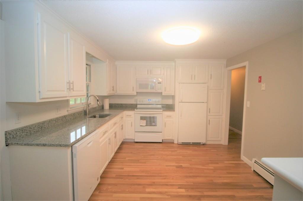 10 Silverbrook Road Topsfield, MA 01983 - Photo 3 of 25 a kitchen with stainless steel appliances granite countertop a sink and cabinets