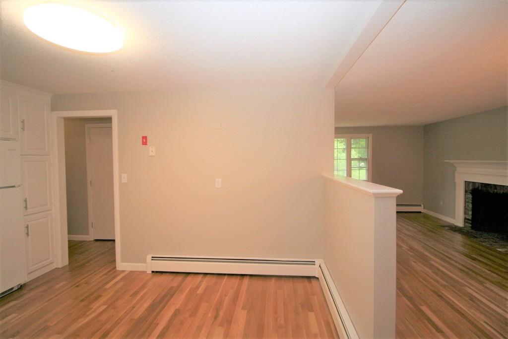 10 Silverbrook Road Topsfield, MA 01983 - Photo 6 of 25 wooden floor in an empty room with a window