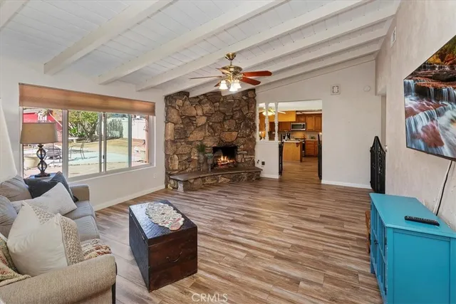 a kitchen with stainless steel appliances granite countertop a sink refrigerator and cabinets