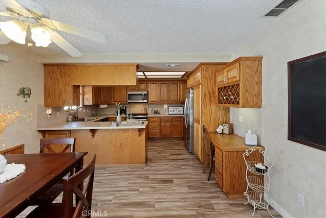 a kitchen with a sink stove top oven and cabinets
