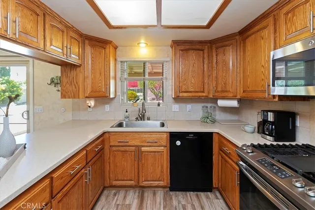 a living room with furniture a couch and dresser