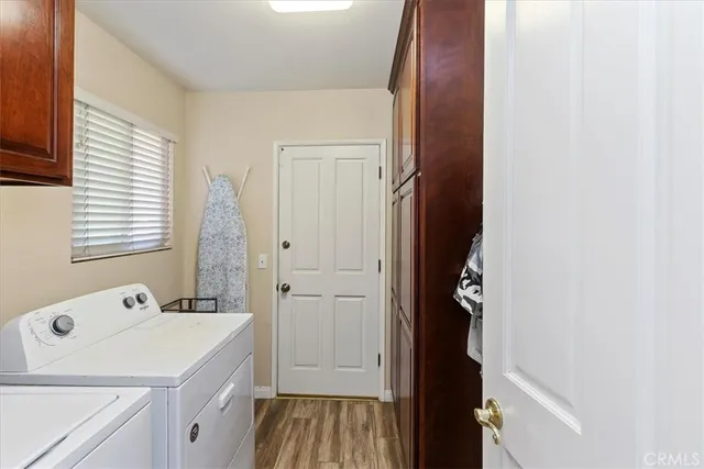 a bedroom with furniture and a chandelier