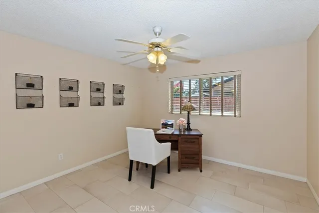 a living room with furniture a table and decor