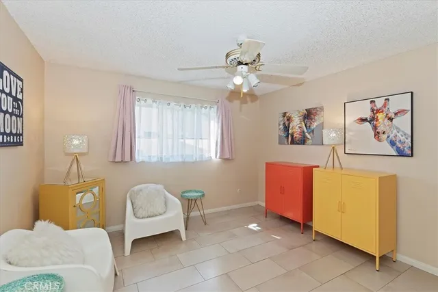a spacious bathroom with a granite countertop sink mirror and