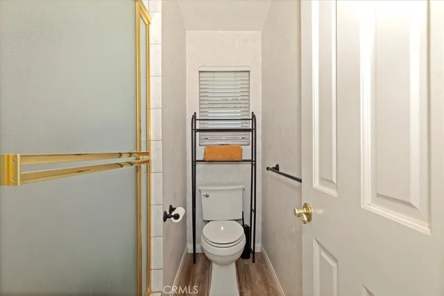 a view of a swimming pool with a chair and tables