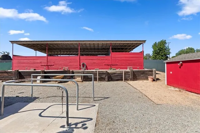 a view of a swimming pool with a table and chairs