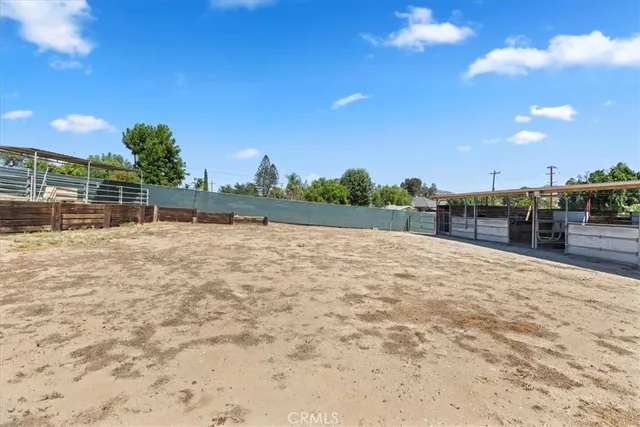 a view of swimming pool with an outdoor space and seating in the background