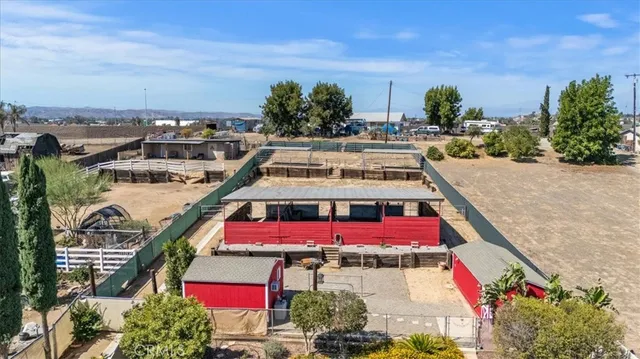 a view of a swimming pool with outdoor seating and plants