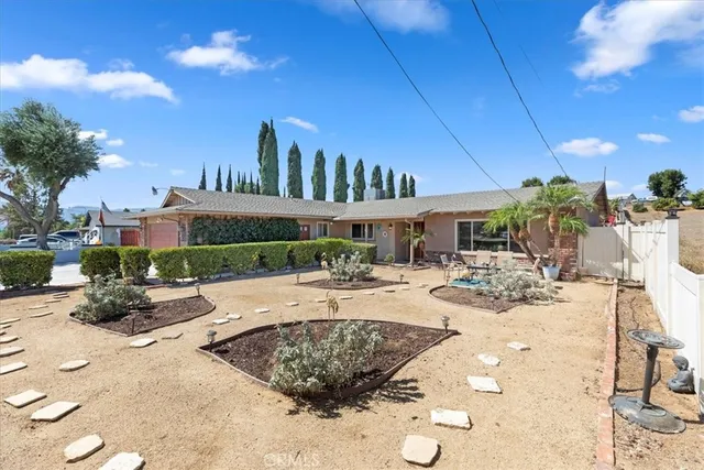 a front view of a house with yard porch and furniture