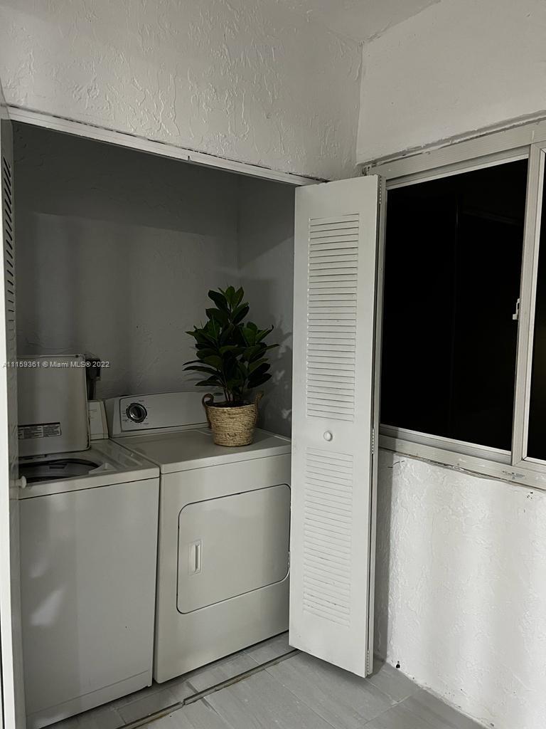 8408 West Sample Road, Unit 218 Coral Springs, FL 33065 - Photo 23 of 25 Laundry room in unit