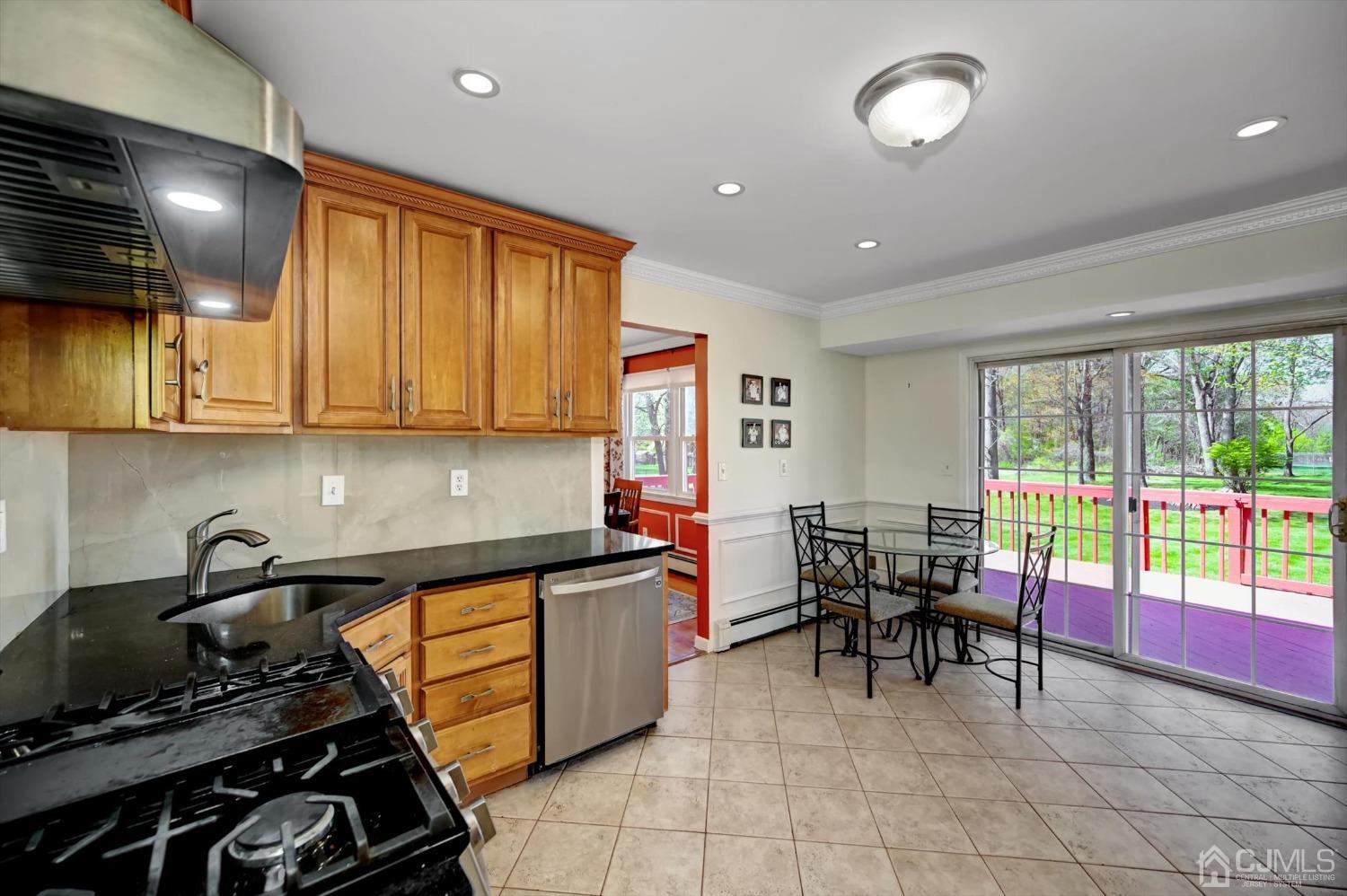 481 Plainfield Road Edison, NJ 08820 - Photo 14 of 42 a kitchen with stainless steel appliances granite countertop a stove a sink and a microwave