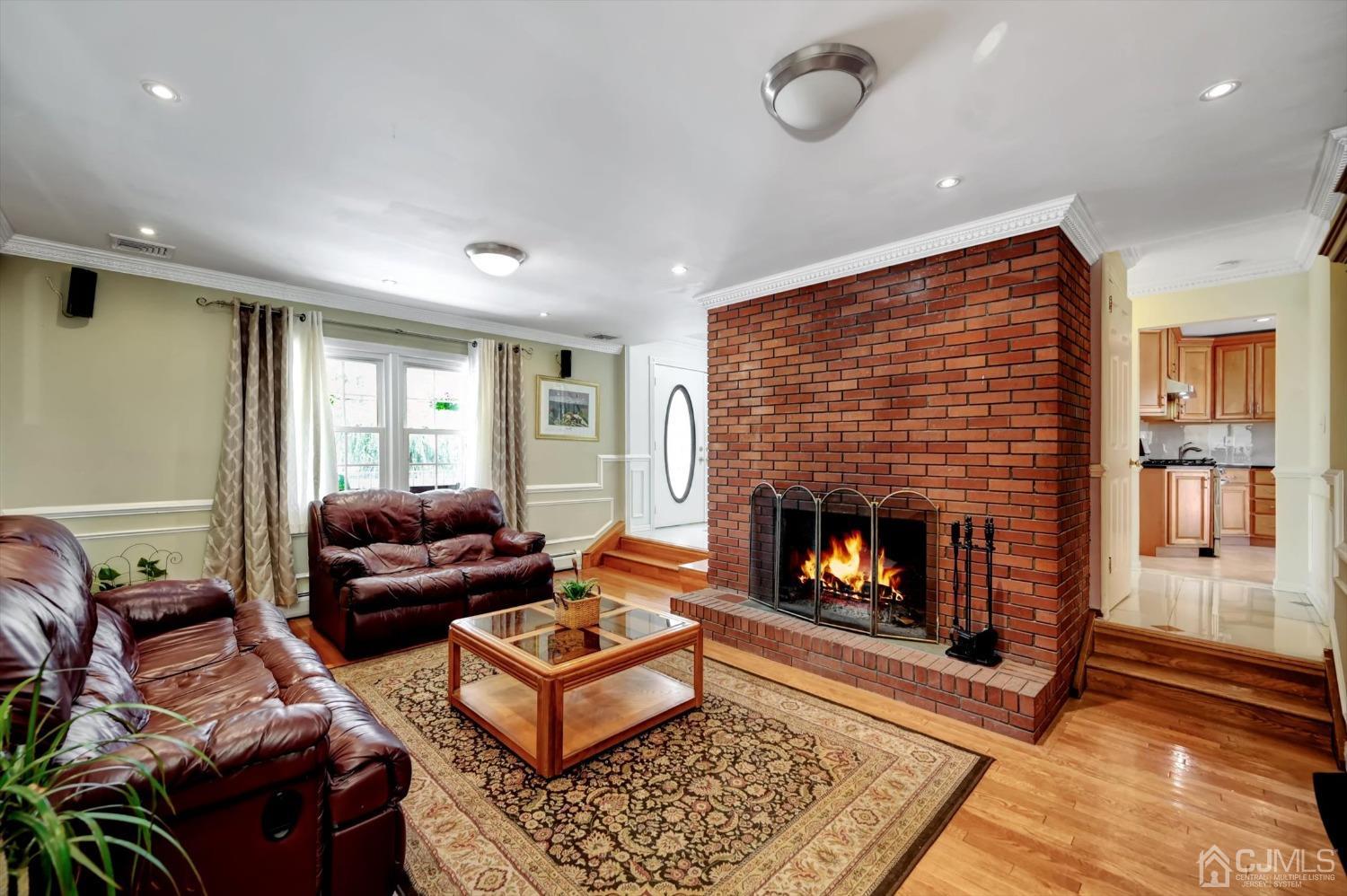 481 Plainfield Road Edison, NJ 08820 - Photo 16 of 42 a living room with furniture and a fireplace