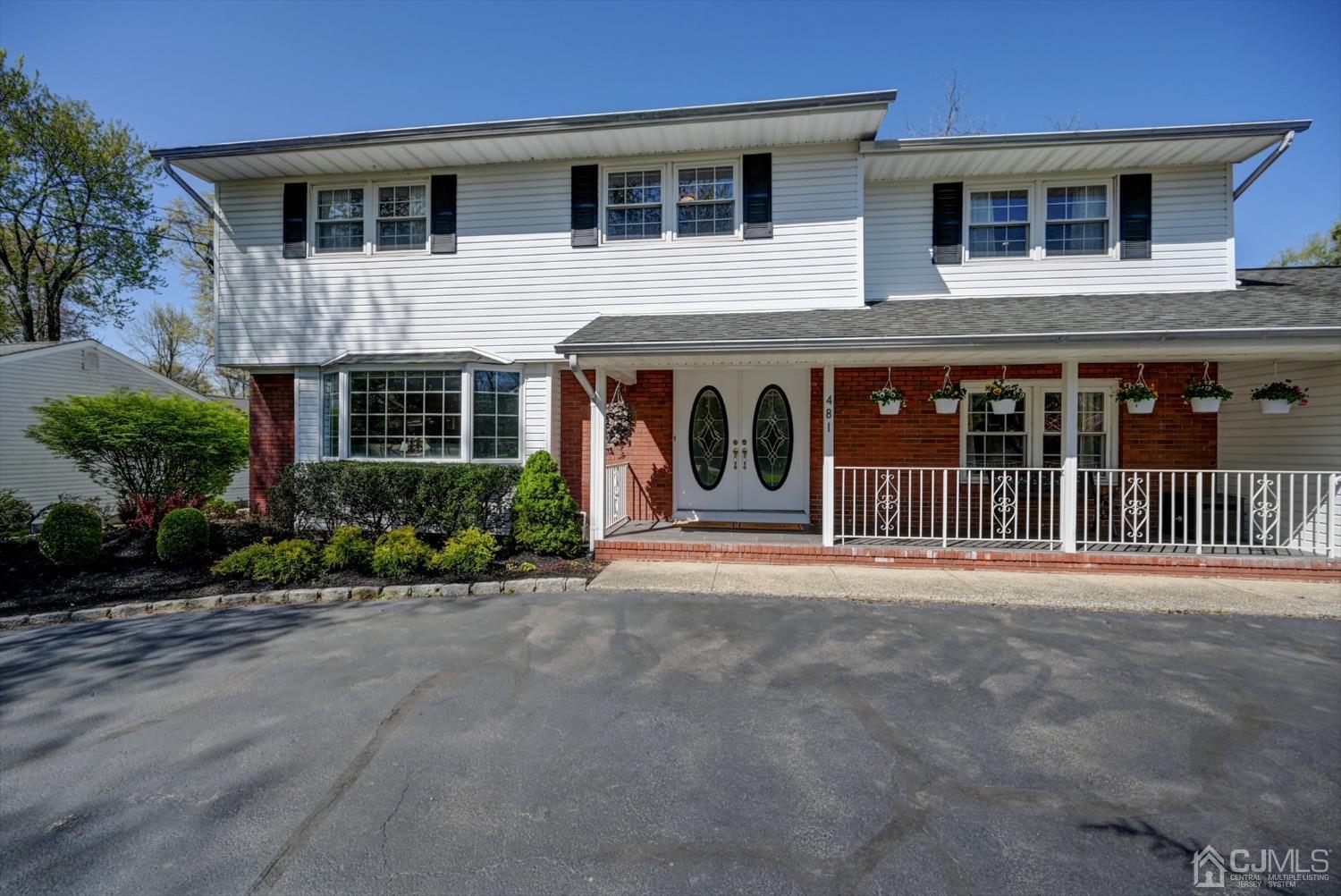 481 Plainfield Road Edison, NJ 08820 - Photo 2 of 42 a front view of a house with a porch