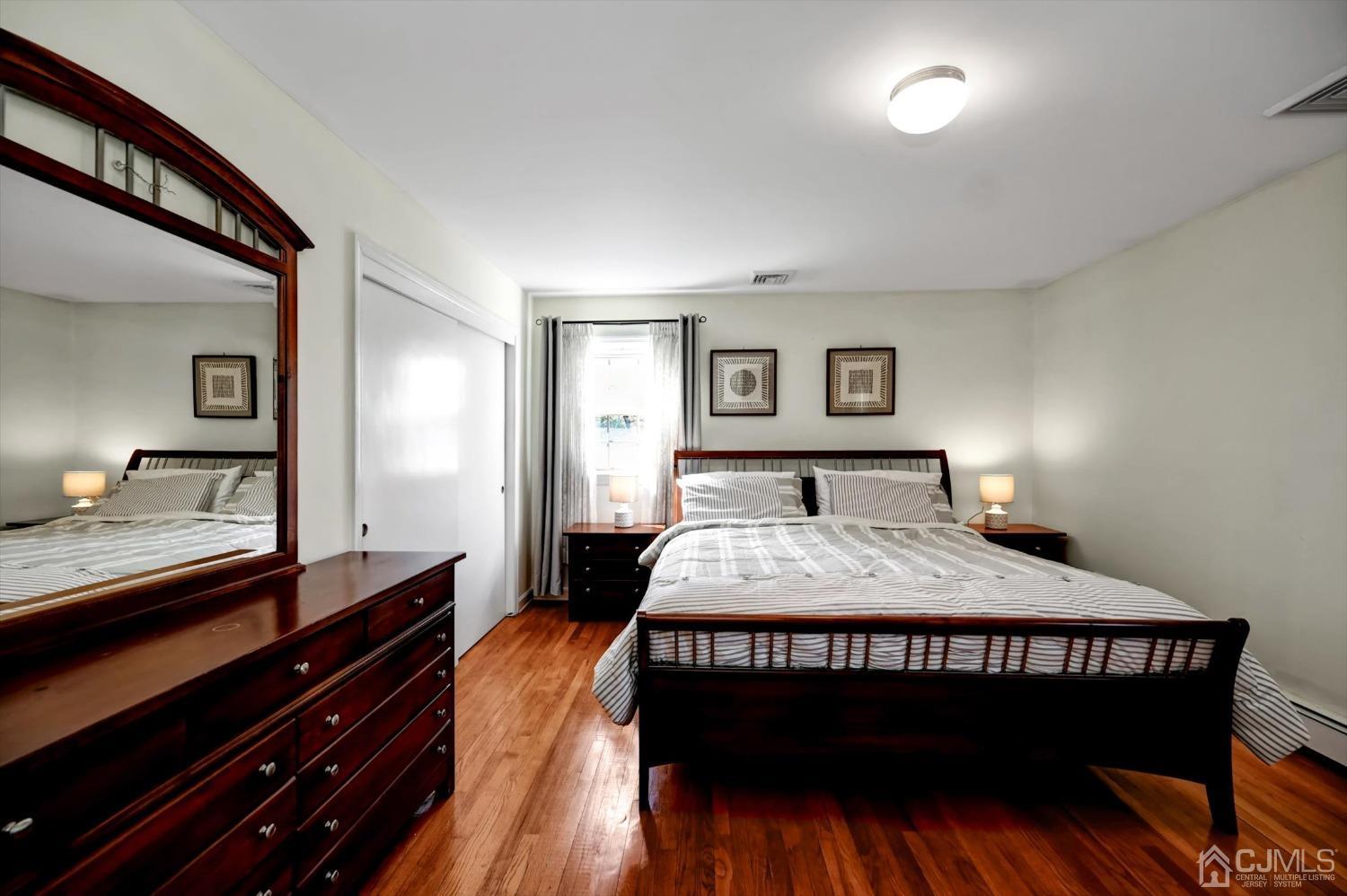 481 Plainfield Road Edison, NJ 08820 - Photo 24 of 42 a bedroom with a bed and a dresser