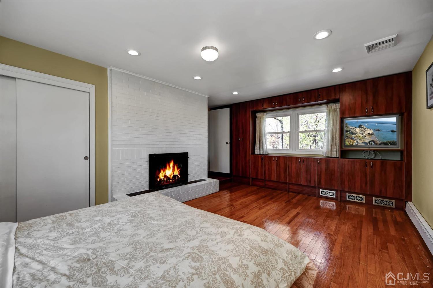 481 Plainfield Road Edison, NJ 08820 - Photo 28 of 42 a view of an empty room window and wooden floor