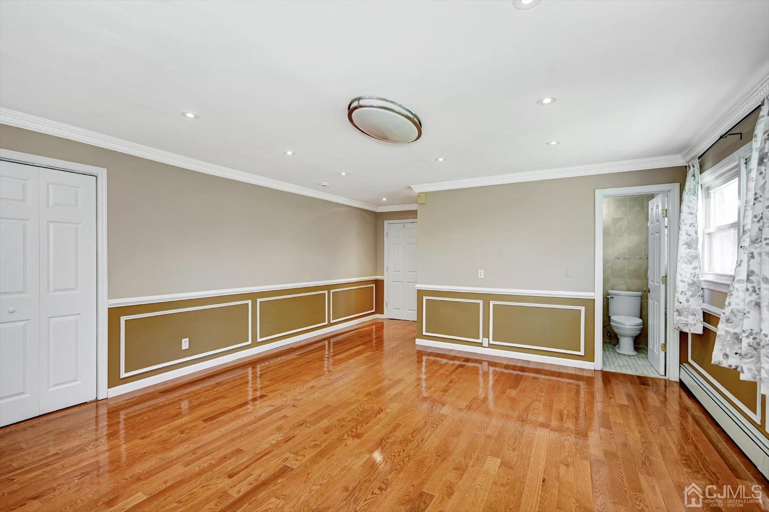 481 Plainfield Road Edison, NJ 08820 - Photo 35 of 42 a view of an empty room with a window and wooden floor